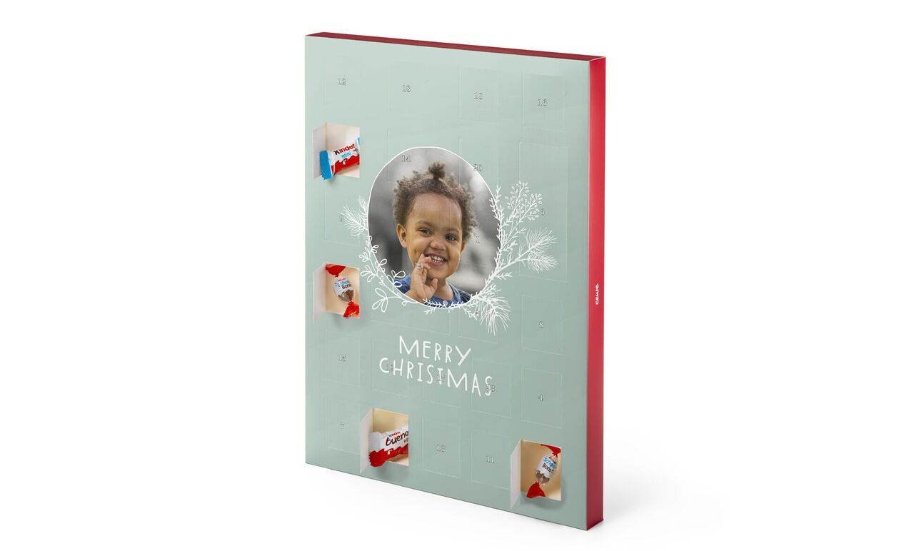 Libro fotografico primaverile con copertina decorata e scritta 'MERRY CHRISTMAS'.